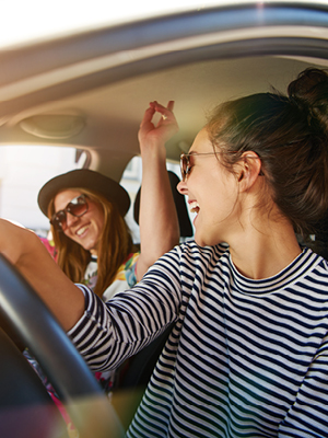girls laughing in a car
