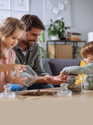 father and daughter counting coins