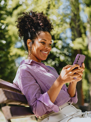 woman on her phone laughing