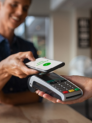 person using a cell phone to make a purchase