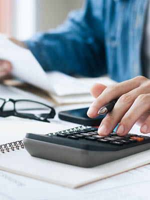 man using a calculator