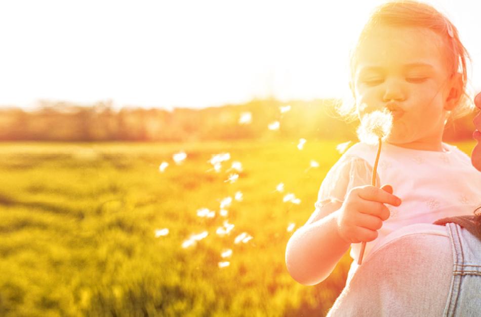 mom and daughter picking flowers