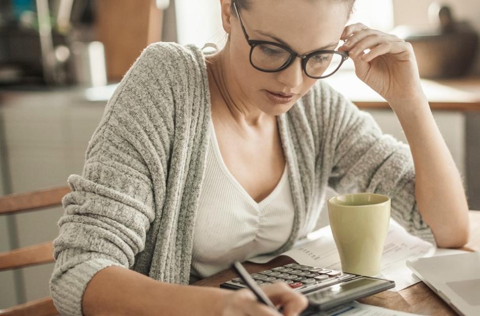Woman at a desk thinking