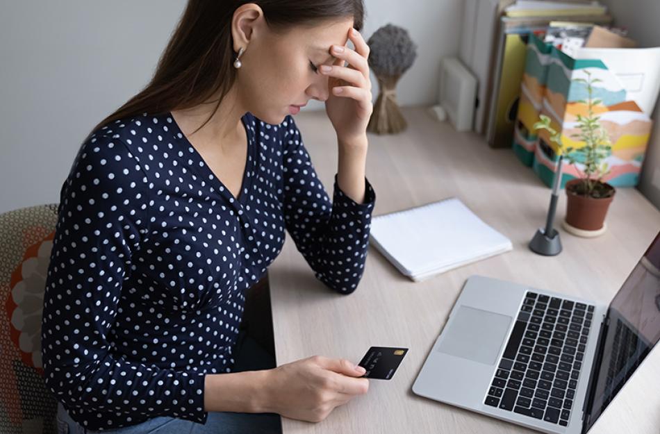 frustrated woman with a credit card