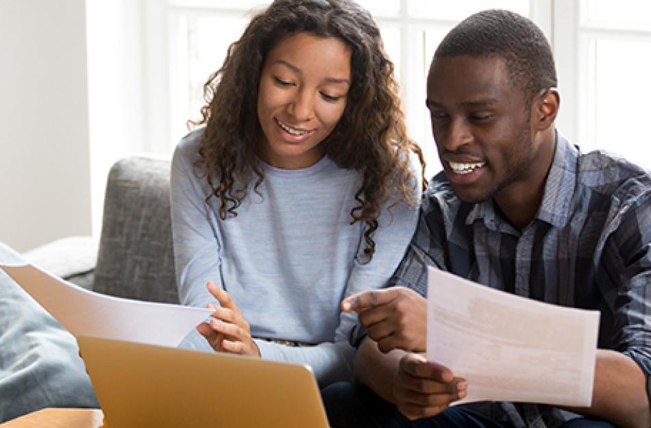 picture of man and woman looking at papers