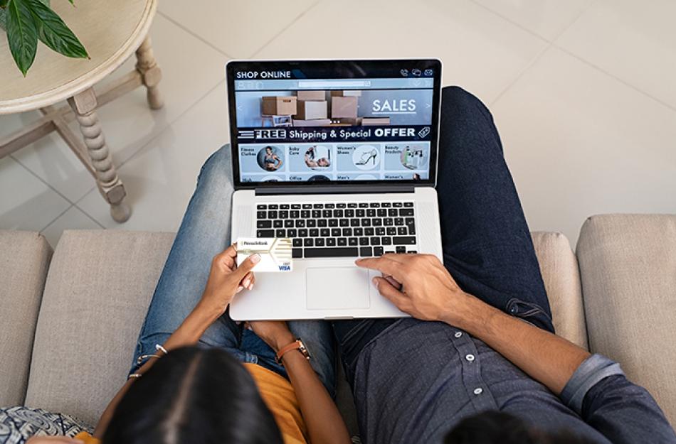 picture of a a couple shopping on their computer