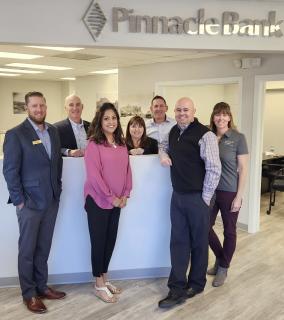 Bankers posing at teller line