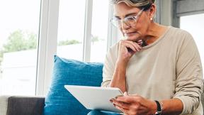 woman looking at her computer