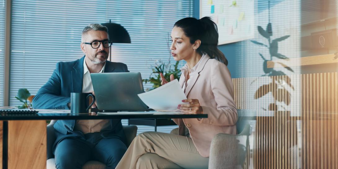 Man and woman at a desk